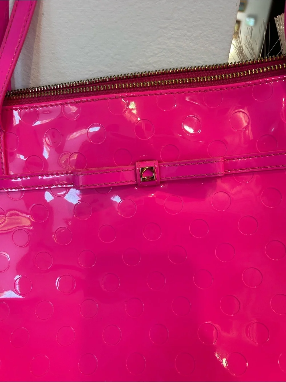 kate spade camellia st Sophie Tote in Hot Pink has a few marks scuffs peeling